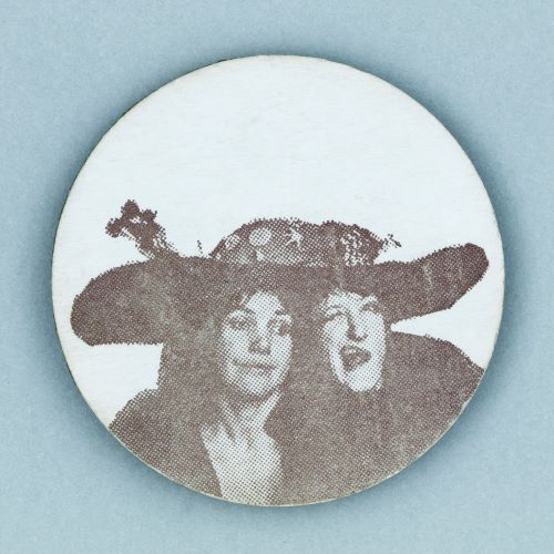 Button badge depicting two women